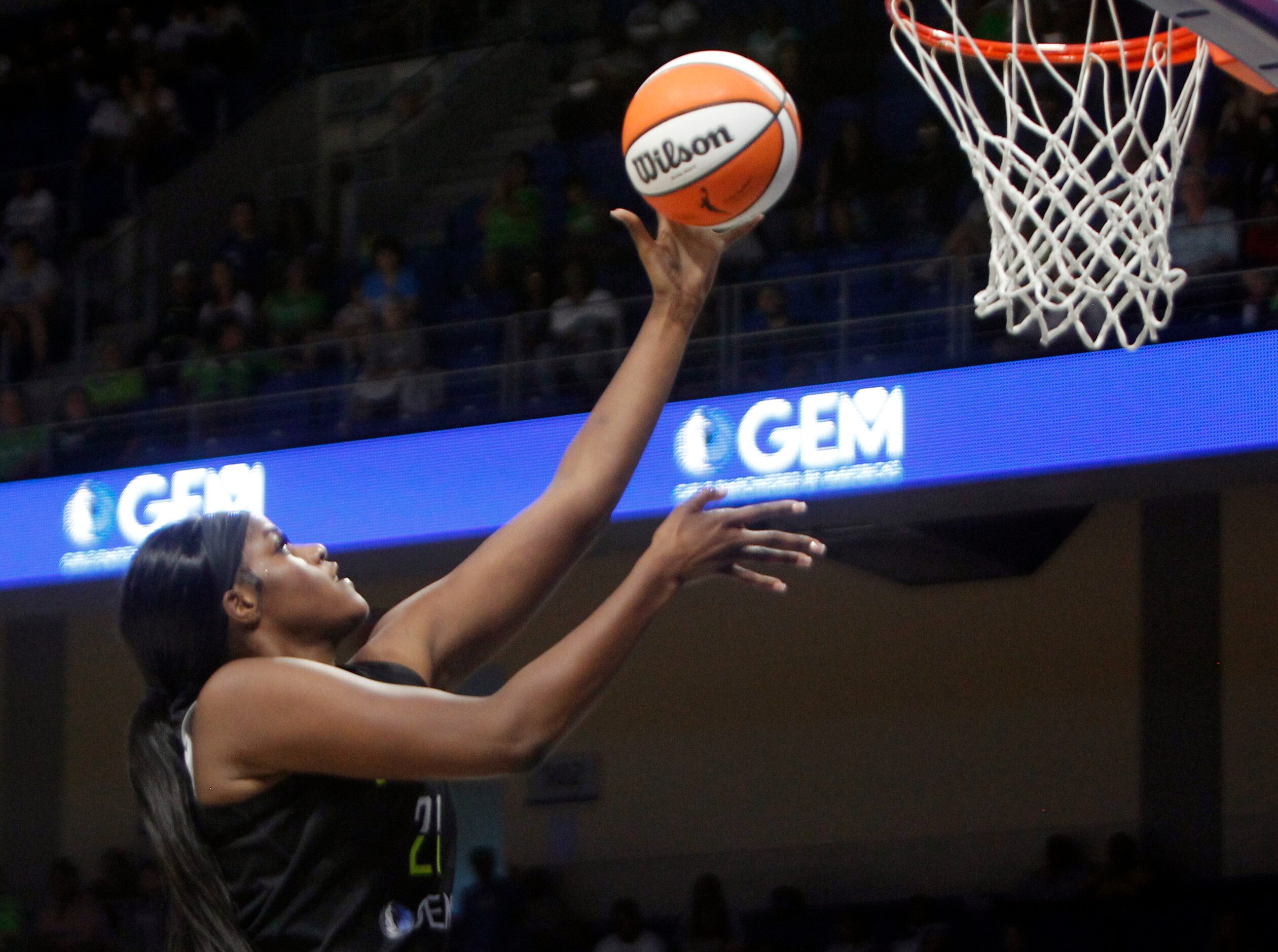 Dallas Wings center Kalani Brown (21) lays up for two of her first half points against the...