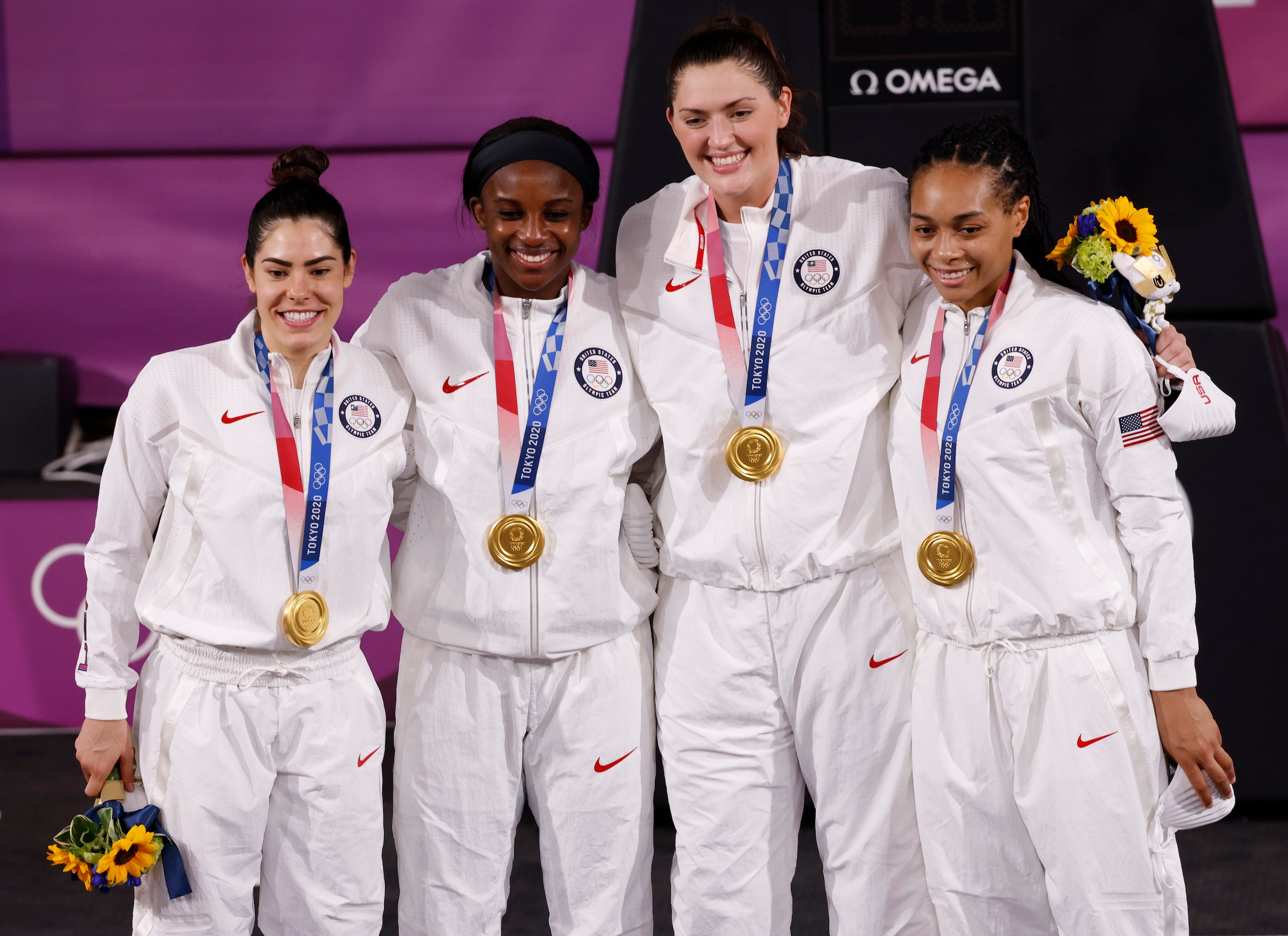 USA’s Kelsey Plum (5), Jacquelyn Young (8), Stefanie Dolson (13), and Allisha Gray (15) pose...