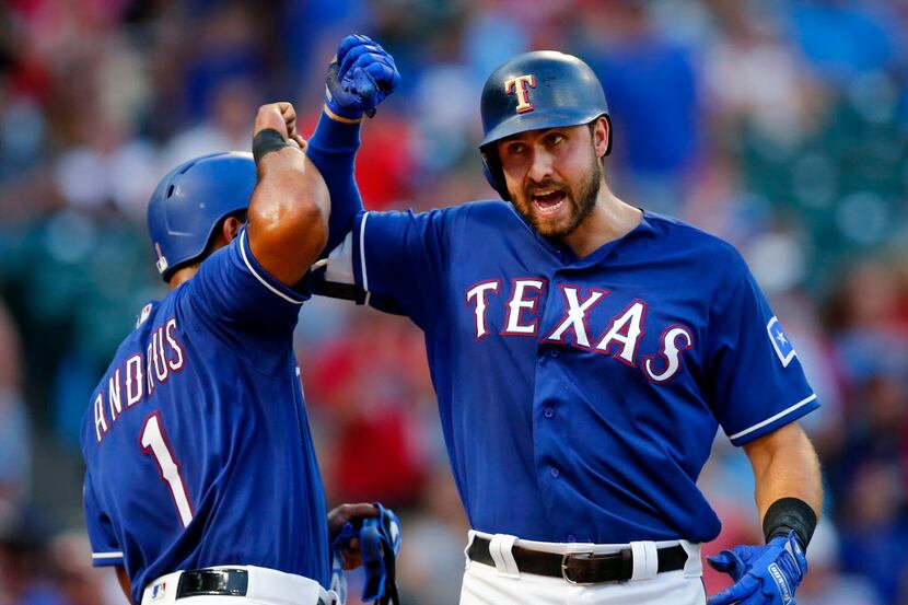 Texas Rangers Joey Gallo (right) is congratulated by teammate Elvis Andrus (1) after he hit...