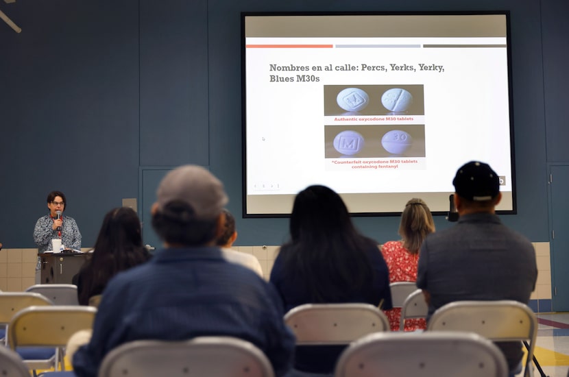 Carrollton-Farmers Branch ISD counselor Sylvia Mazuera leads a parent workshop at the...