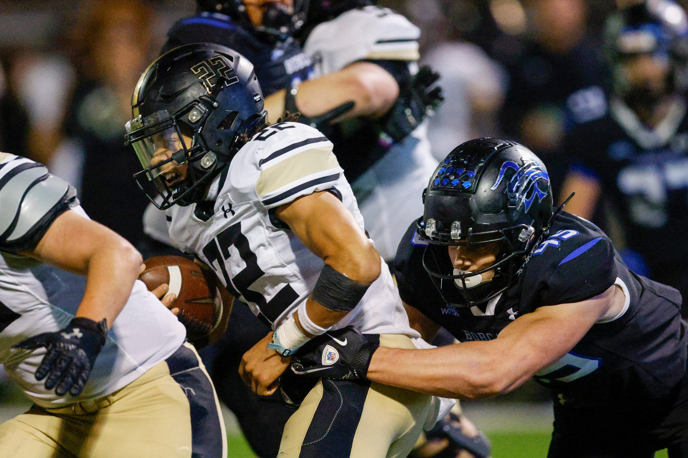 Trophy Club Byron Nelson’s Justin McCauley (45) tackles Keller Fossil Ridge running back...