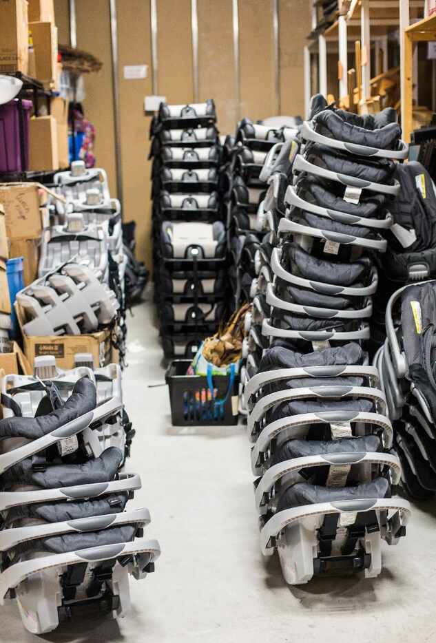 Piles of car seats are prepared in Austin for shipment to a Houston "Rainbow Room, " which...
