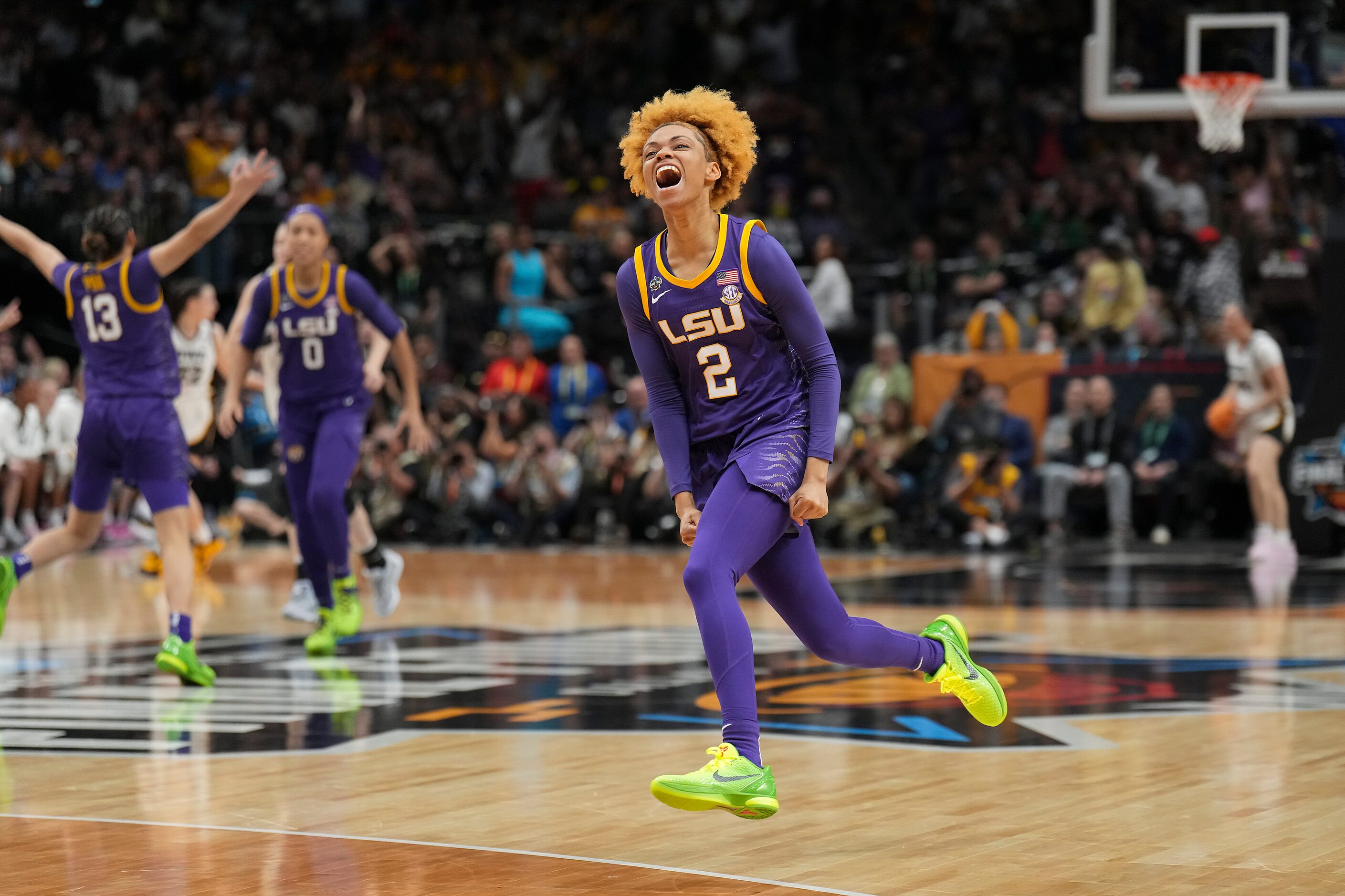 LSU guard Jasmine Carson (2) celebrates after hitting a three-pointer during the first half...