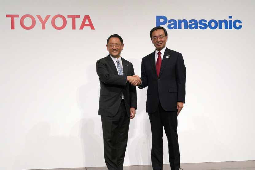 Toyota Motor Corporation President Akio Toyoda (left) and Panasonic Corporation President...