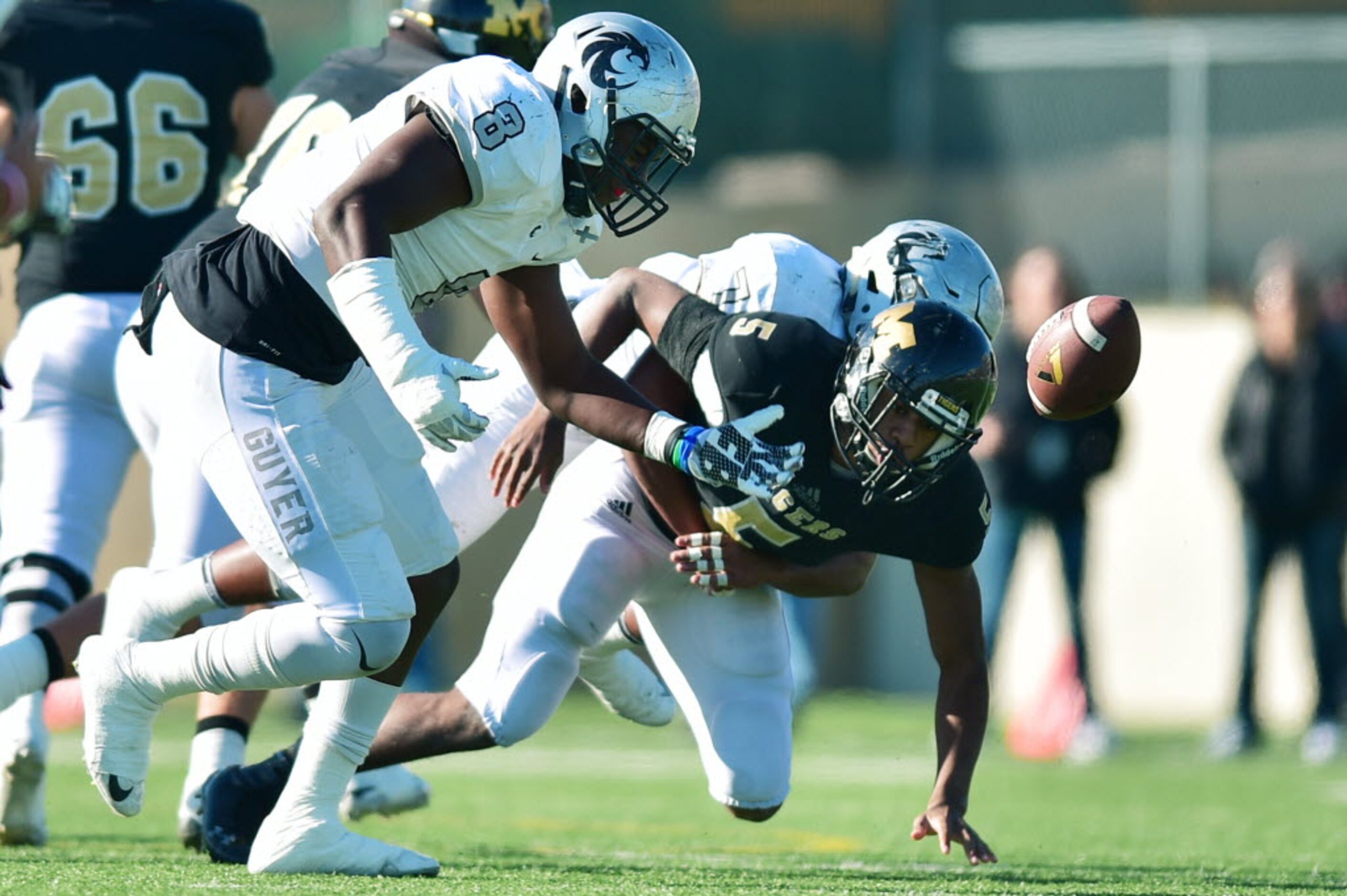 Guyer senior defensive end Tevan McAdams (8) breaks up a pass meant for Mansfield junior...