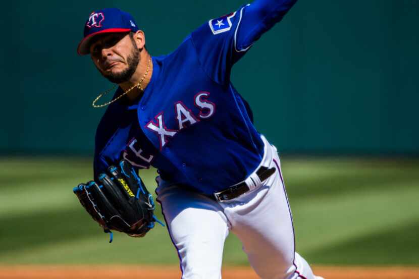 Texas Rangers starting pitcher Martin Perez (33) pitches during the second inning of a...