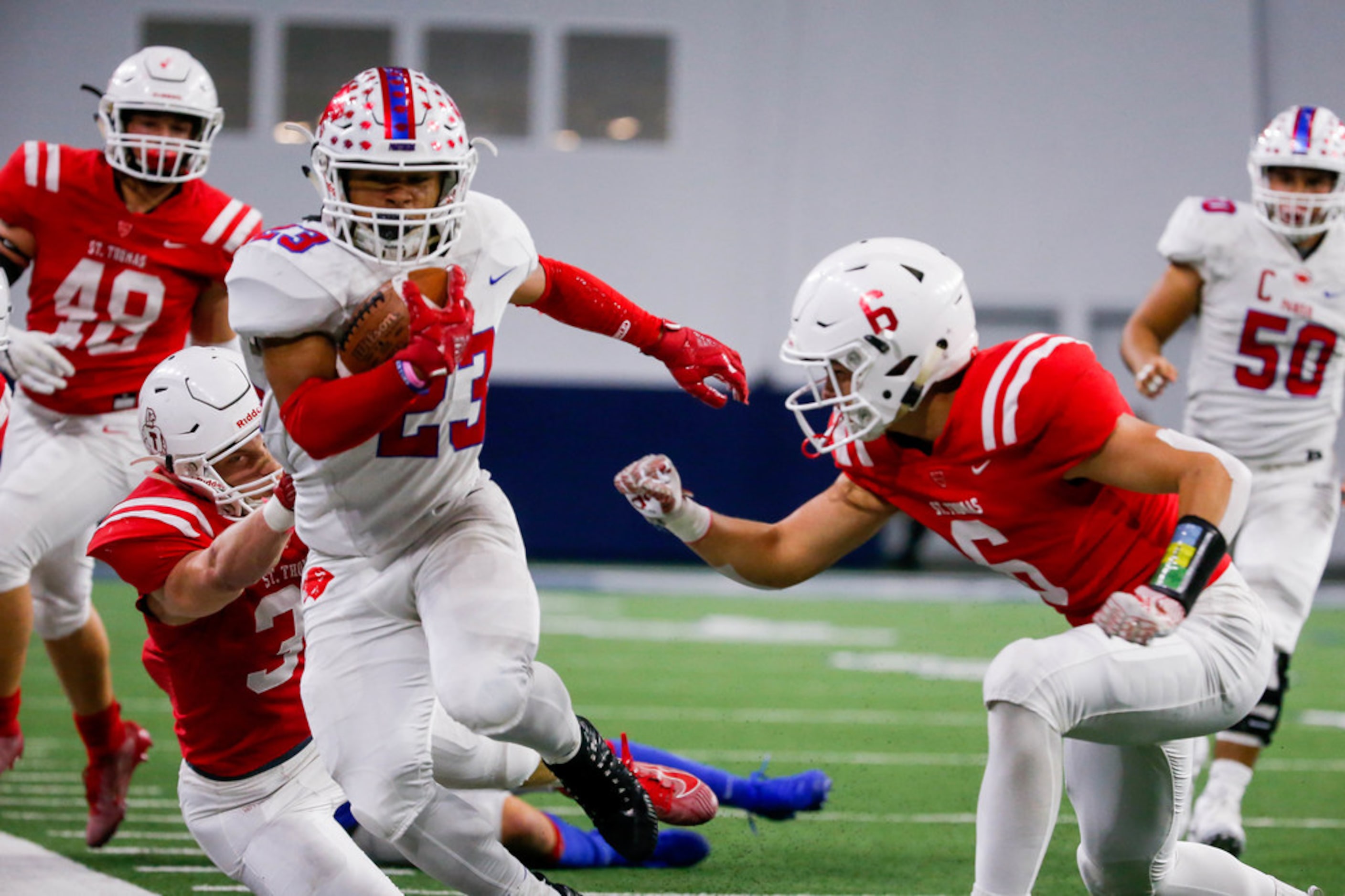 Parish Episcopal running back Christian Benson (23) fails to evade the Houston St. Thomas...