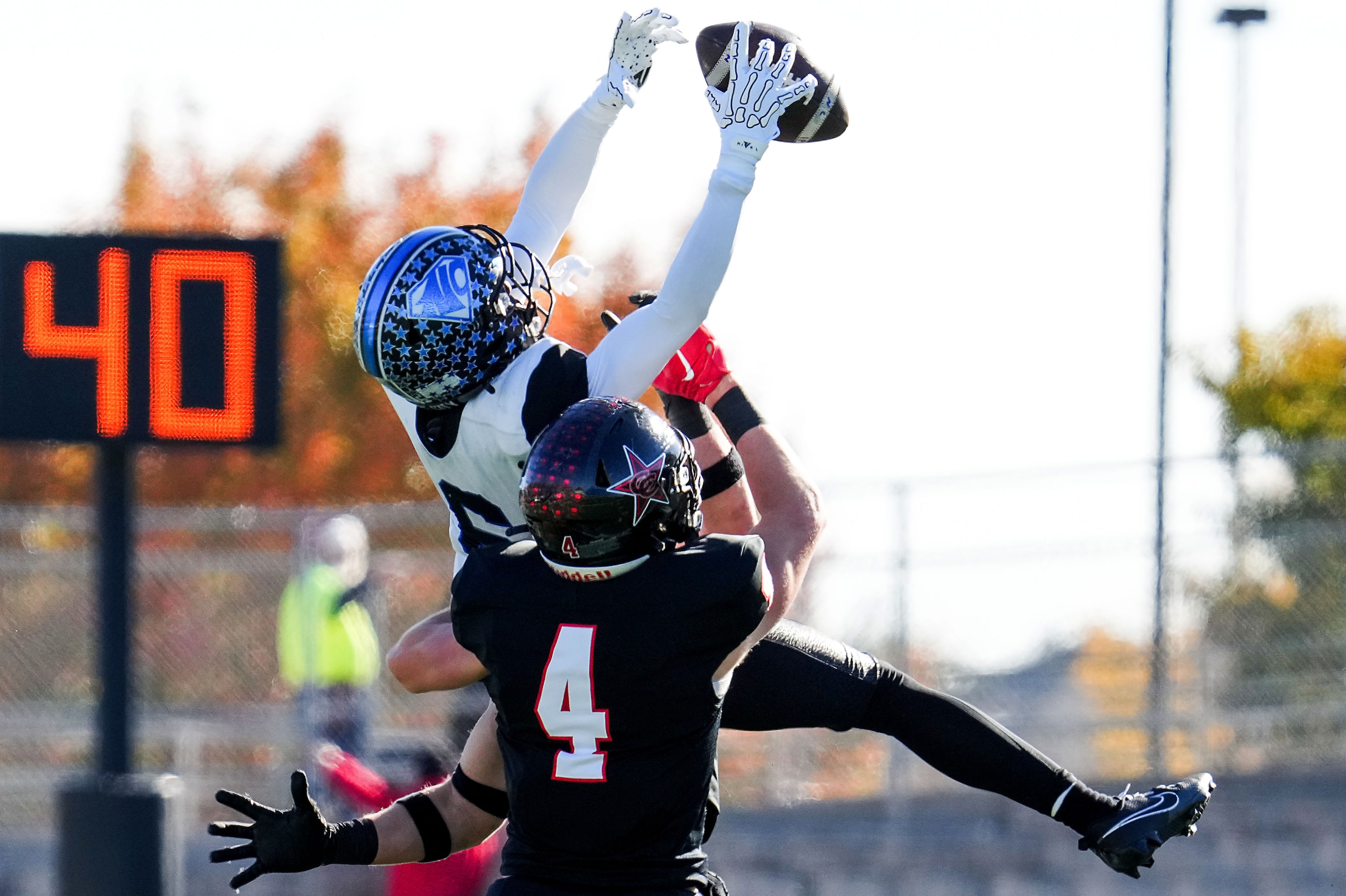 North Crowley wide receiver Quentin Gibson (6) makes a leaping catch over Coppell defensive...