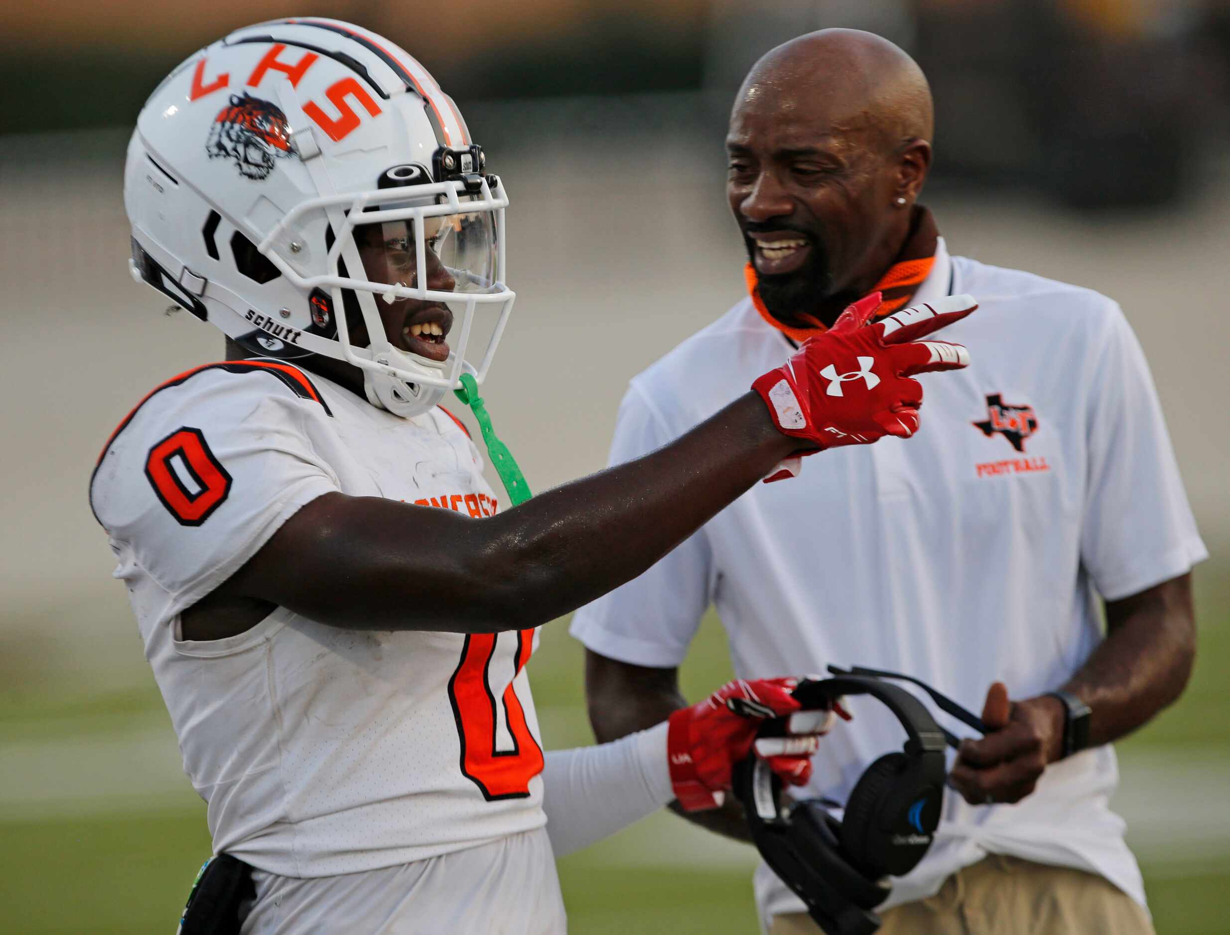 Ti’Erick Martin (0) talks with a coach during a break in the action during  the first half...