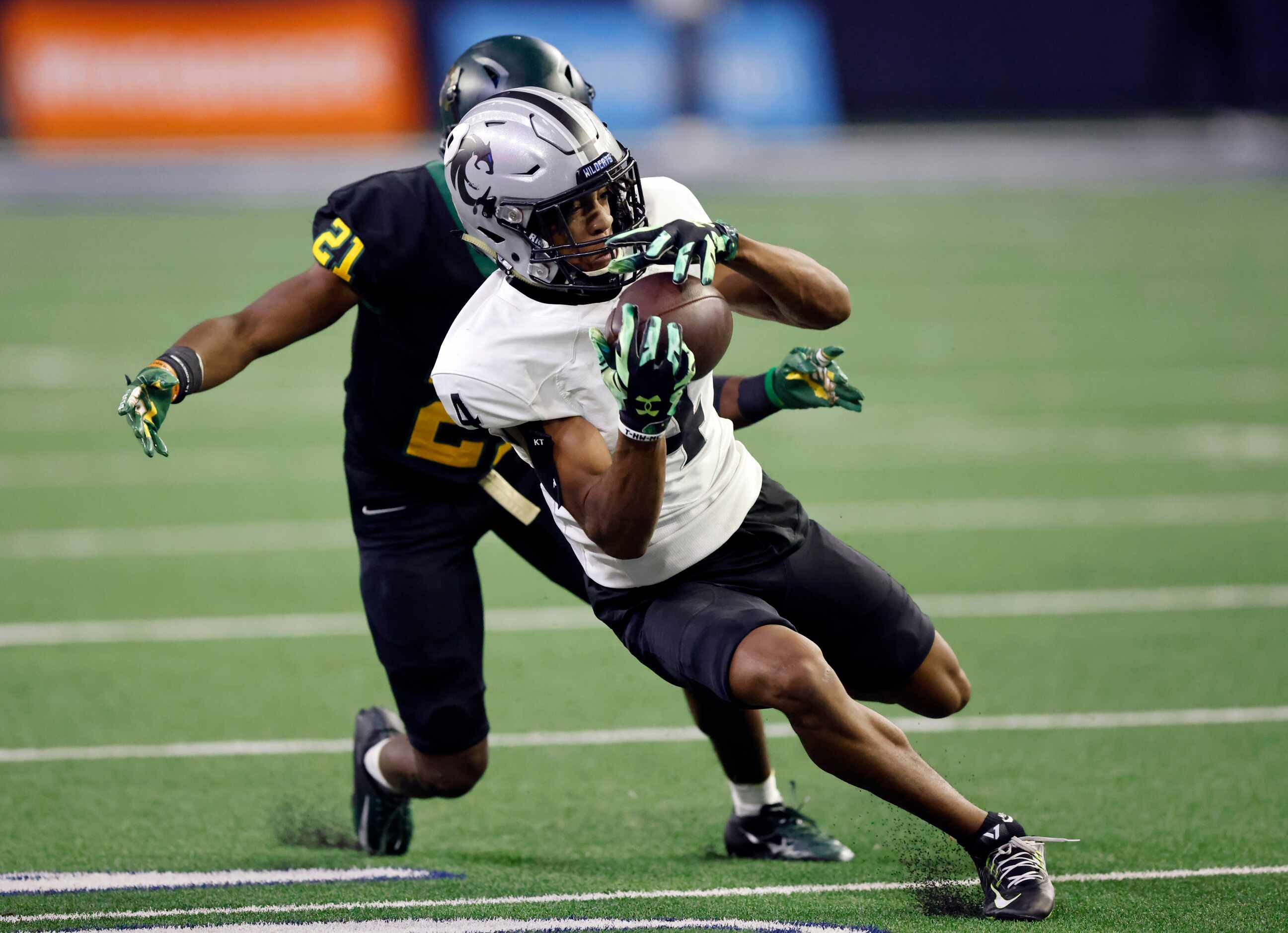 Denton Guyer receiver Josiah Martin (4) catches a first half pass in front of the DeSoto...