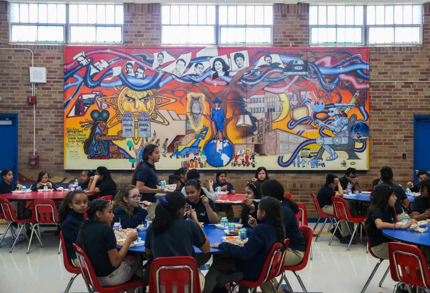 Students eat lunch in the cafeteria of La Fe Preparatory School in El Paso.