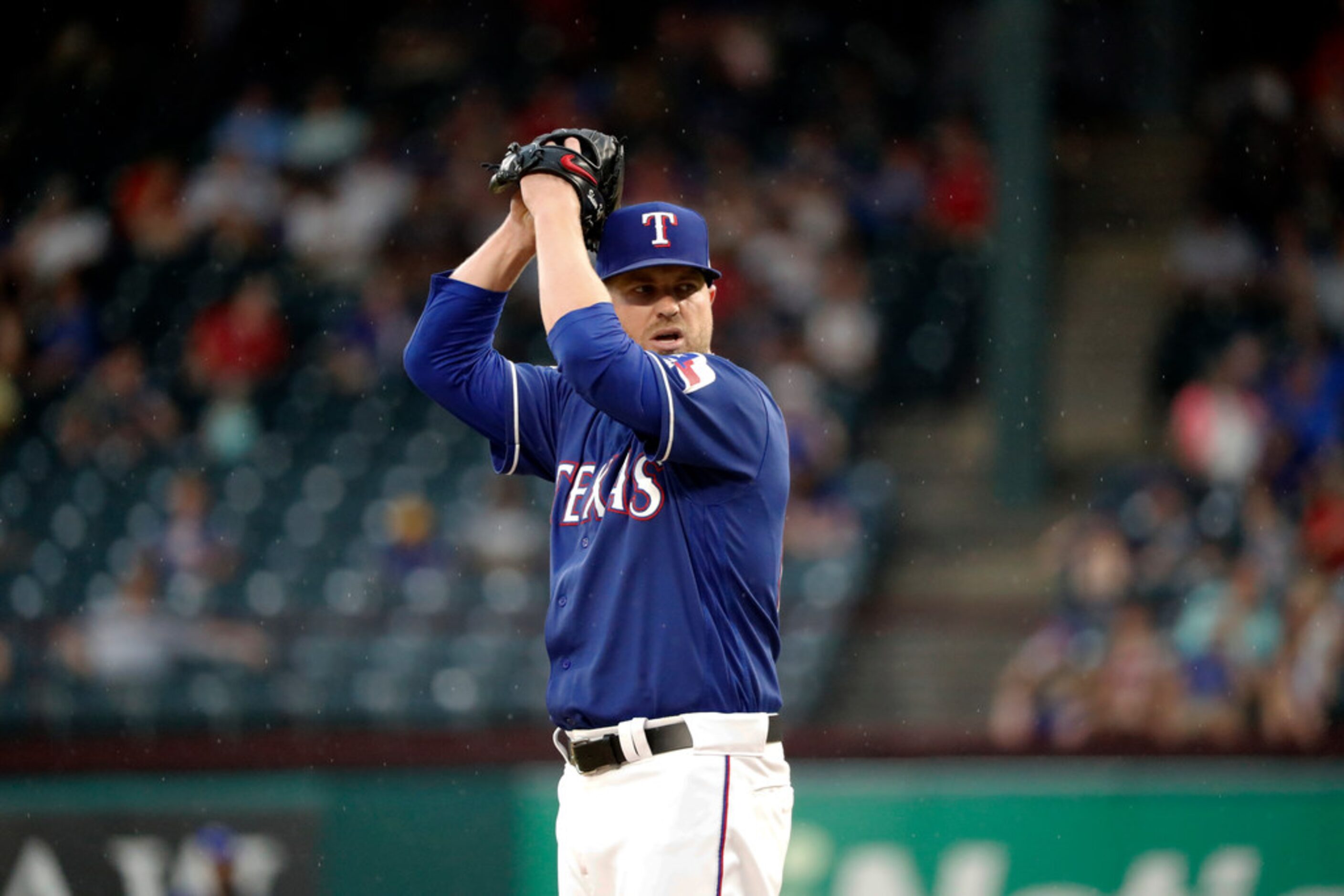 Texas Rangers' Shawn Kelley works against the Kansas City Royals in the ninth inning of a...