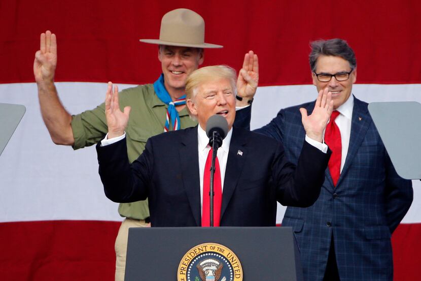 President Donald Trump joined former Boy Scouts, Interior Secretary Ryan Zinke, left, Energy...