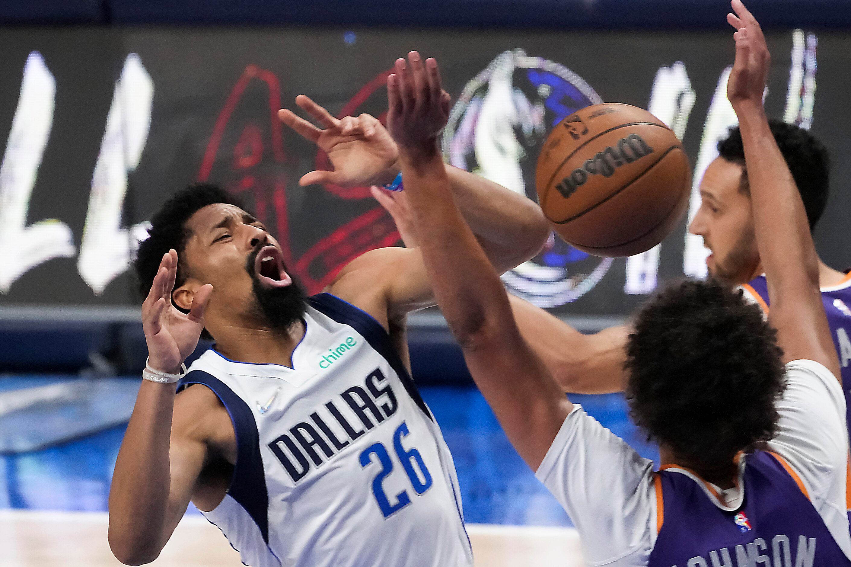 Dallas Mavericks guard Spencer Dinwiddie (26) is fouled by Phoenix Suns forward Cameron...