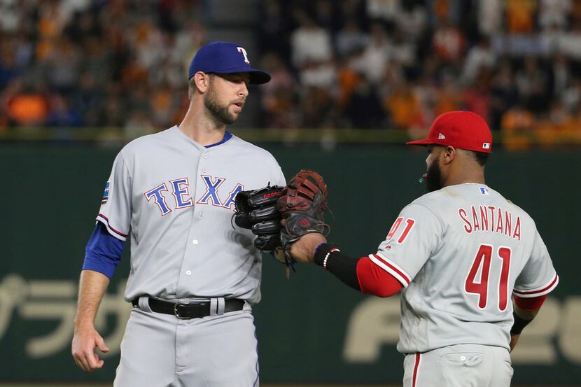 MLB All-Star closer Chris Martin, left, of the Texas Rangers celebrates with first baseman...