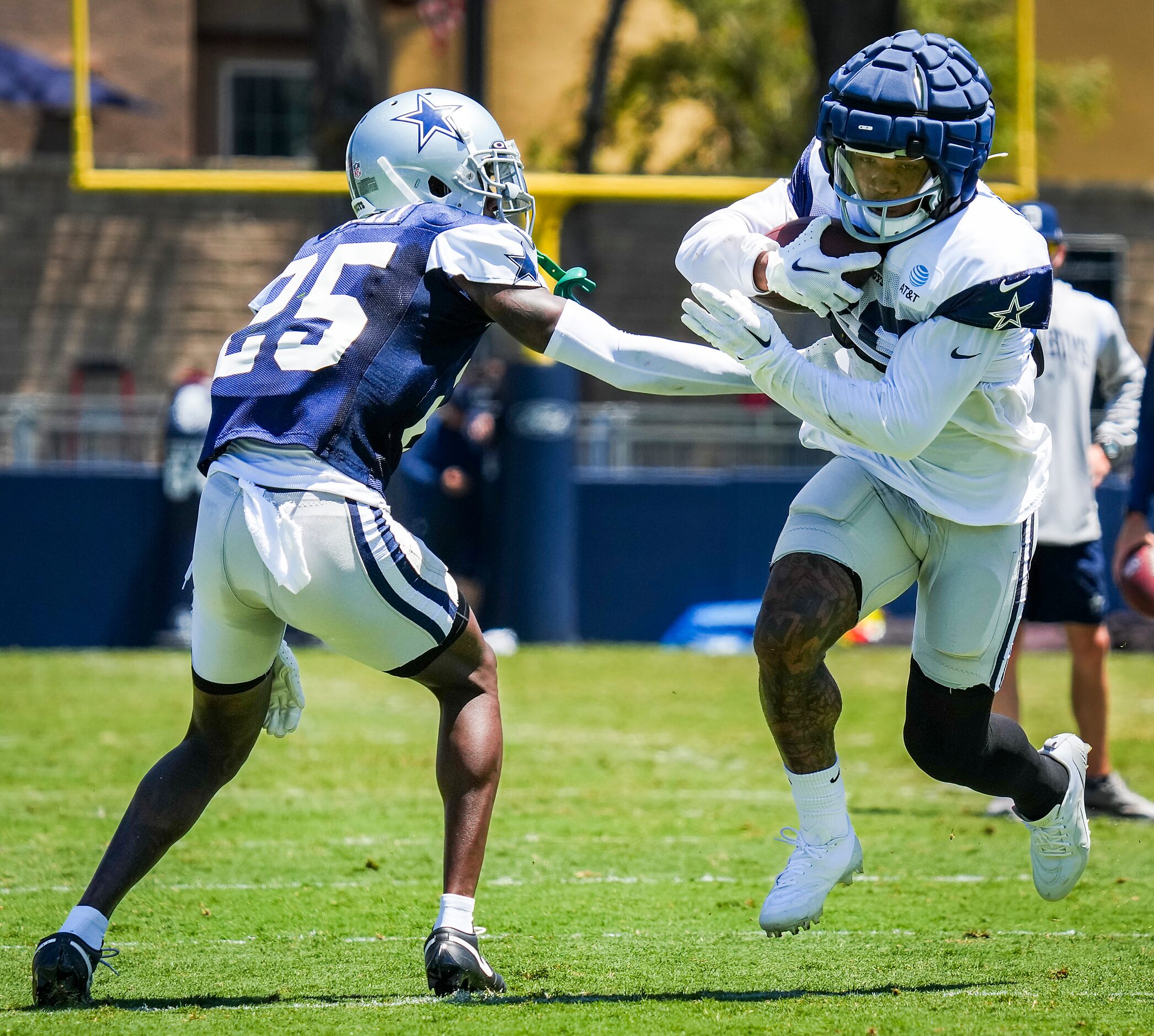 Dallas Cowboys running back Tony Pollard (20) gets past cornerback Nahshon Wright (25)...