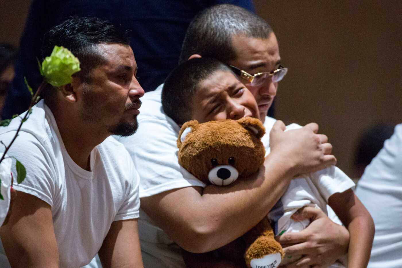 Mourners console each other during a candelight vigil for Jazmine Alfaro at Family Cathedral...