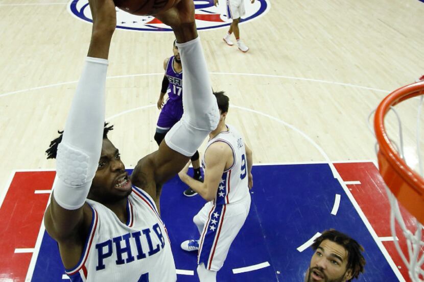 Philadelphia 76ers' Nerlens Noel (4) goes up for a dunk against Sacramento Kings' Willie...