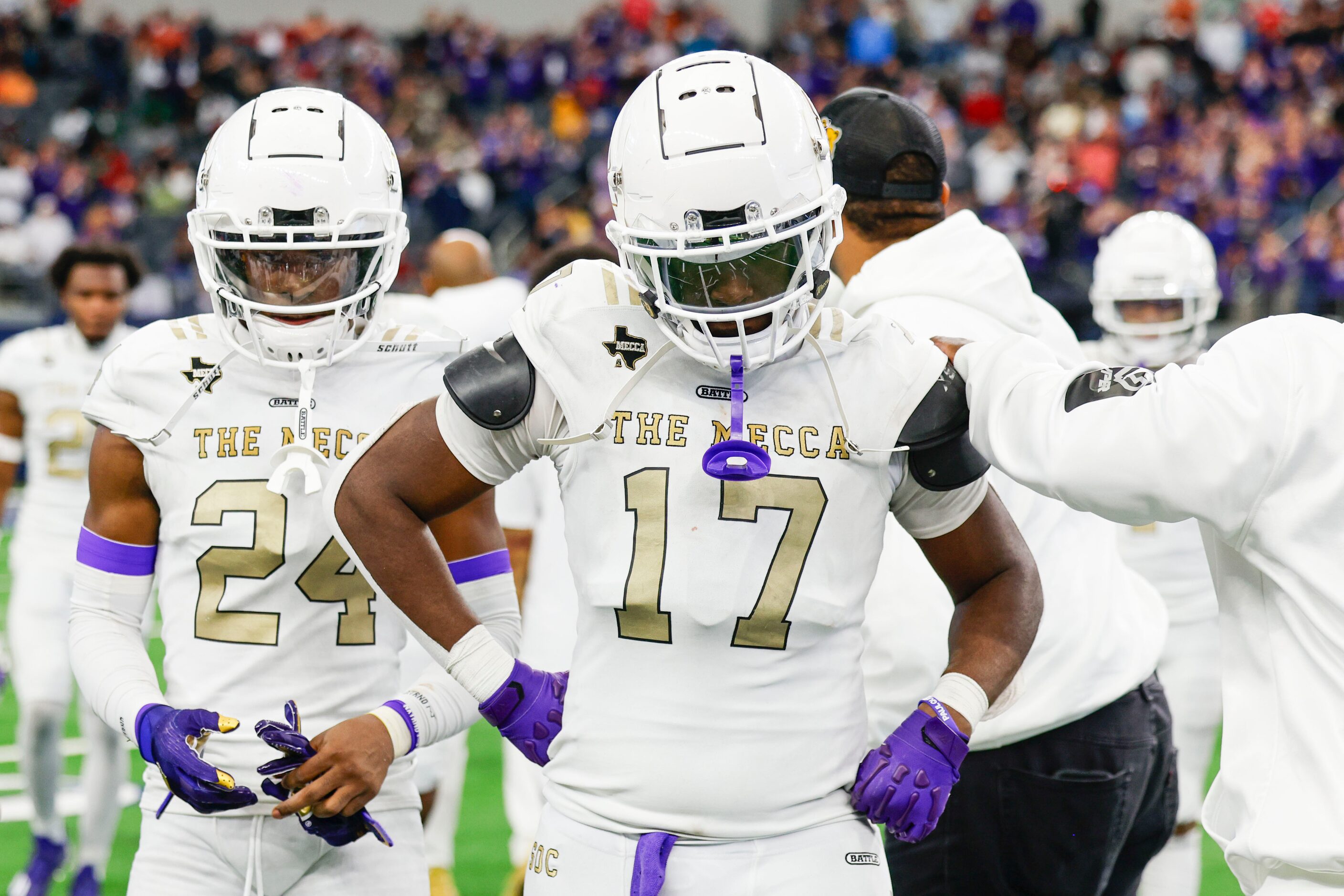 South Oak Cliff players Tobias Gary (left) and Paul Blair leaves the field after their loss...