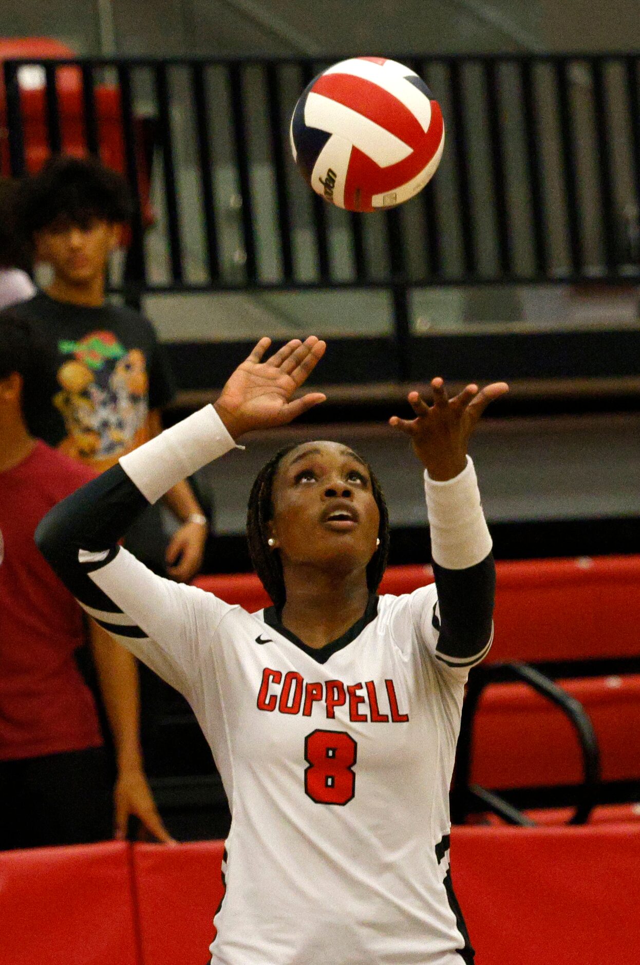 Coppell's Daki Kahungu (8) serves against Flower Mound during a high school girl’s...