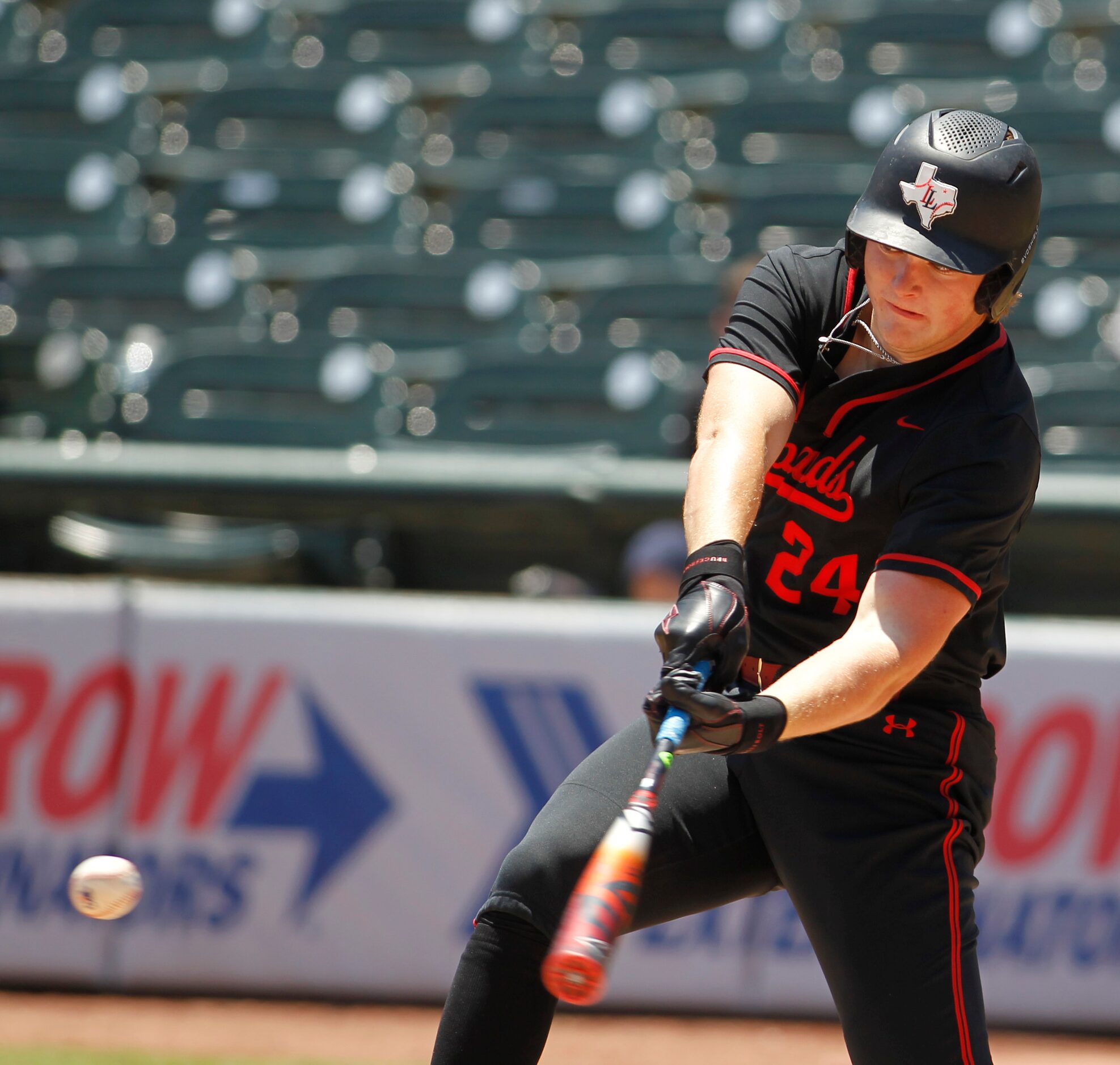 Lovejoy 1st baseman Garrett Hutchins (24) lines a pitch foul while batting in the top of the...