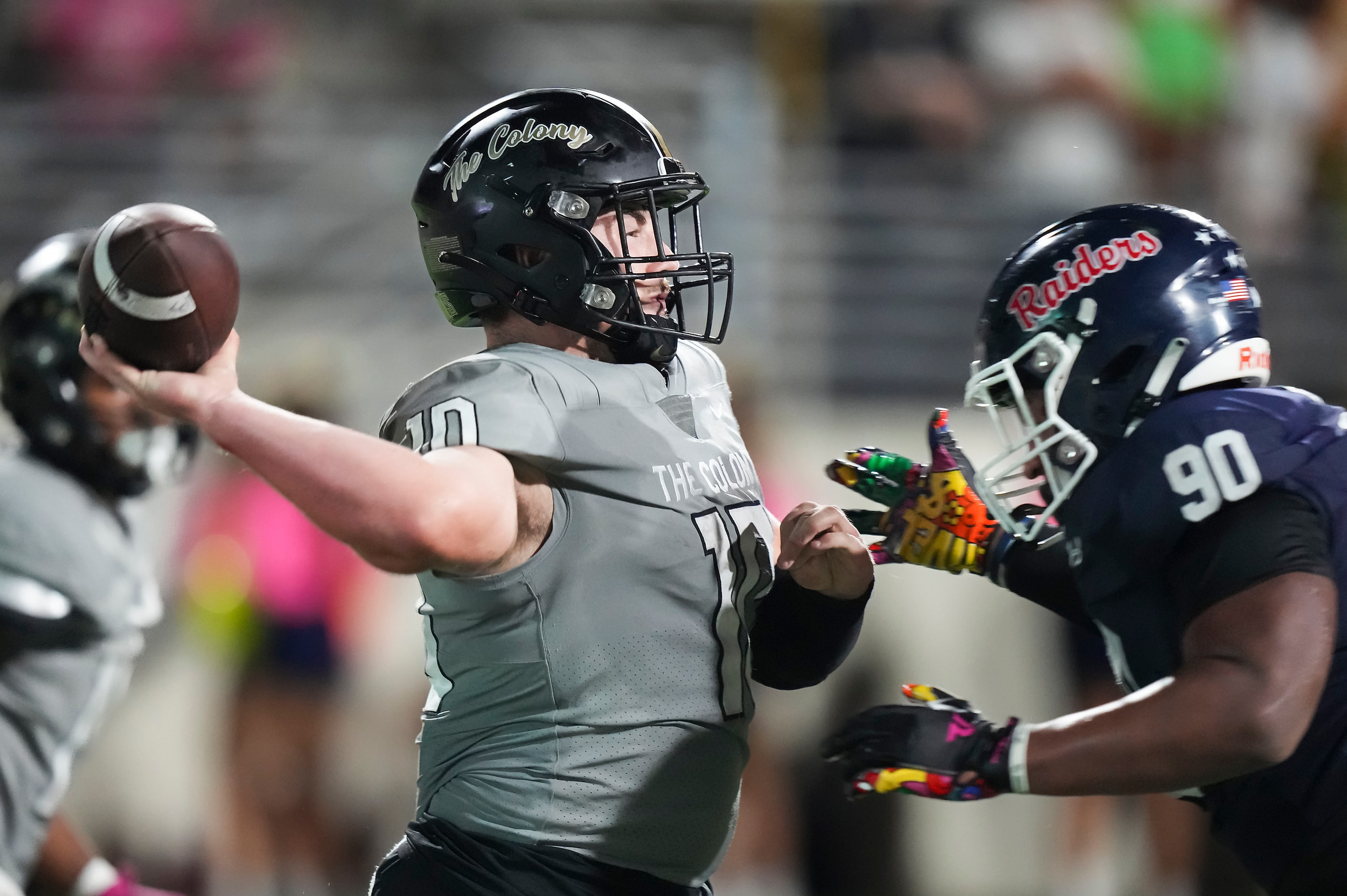 The Colony quarterback Carson Cox (10) throws a pass under pressure from Denton Ryan...