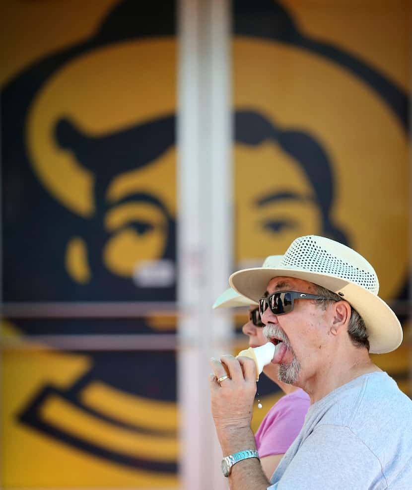Steve Bradshaw eats an ice cream cone at the State Fair of Texas at Fair Park in Dallas on...