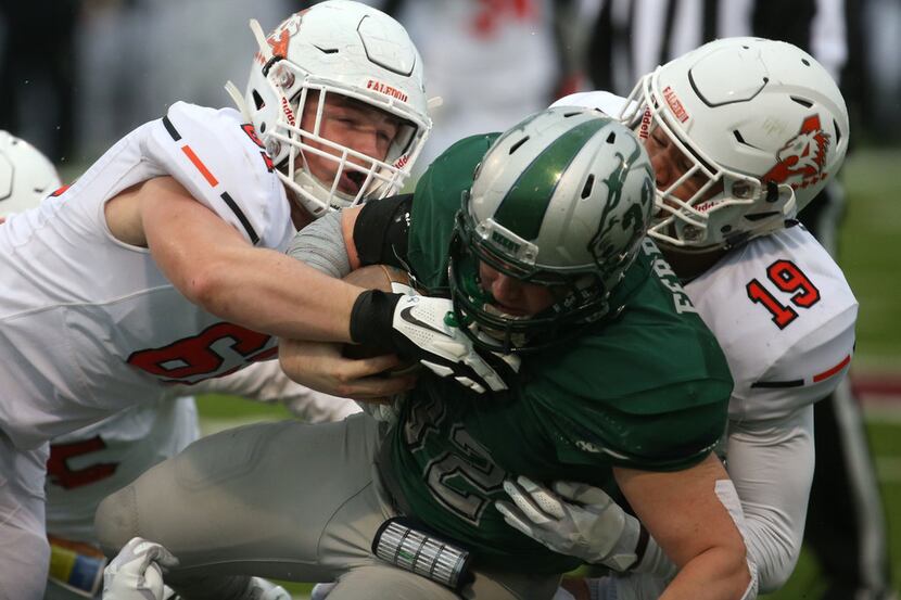 Aledo's Oliver Crow (61) Tre Owens (19) tackle Reedy's MIchael Ferrara (31) during the first...