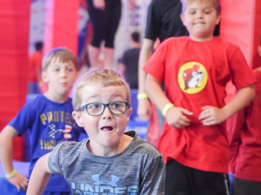 Children take on challenges in the obstacle course gym at Ninja Nation in Frisco. 