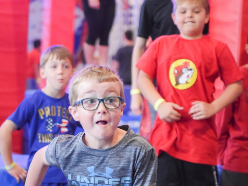 Children take on challenges in the obstacle course gym at Ninja Nation in Frisco. 