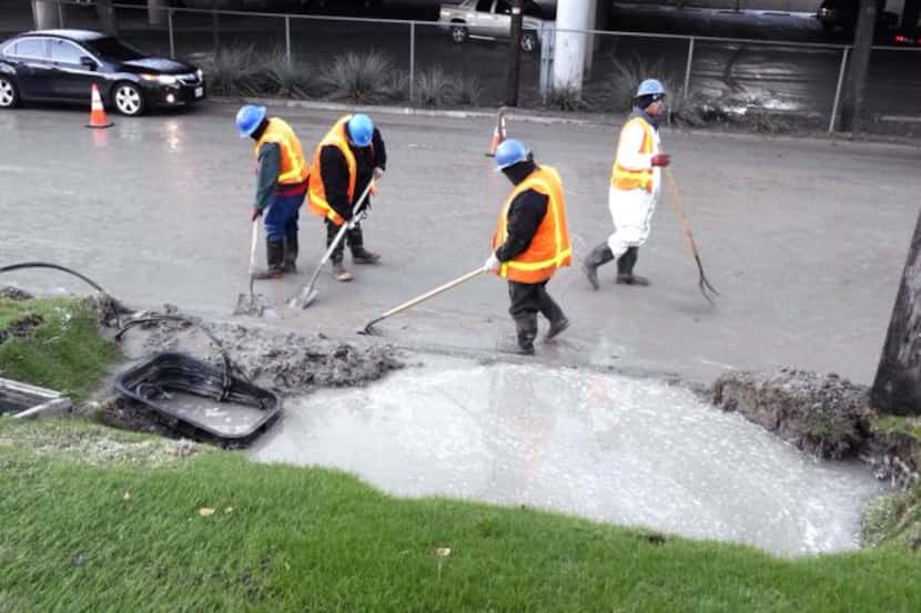 
A City of Dallas Water Utilities crew works on a water main break Nov. 17 on the Interstate...