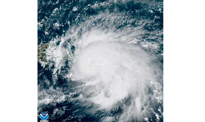 This satellite image provided by NOAA shows Hurricane Fiona in the Caribbean on Sunday,...