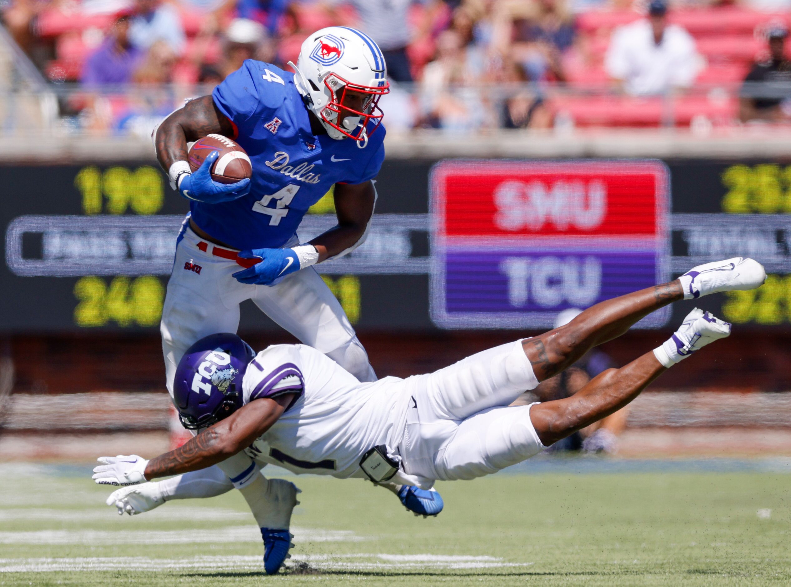 TCU cornerback Tre'Vius Hodges-Tomlinson (1) dives to tackle SMU running back Tre Siggers...