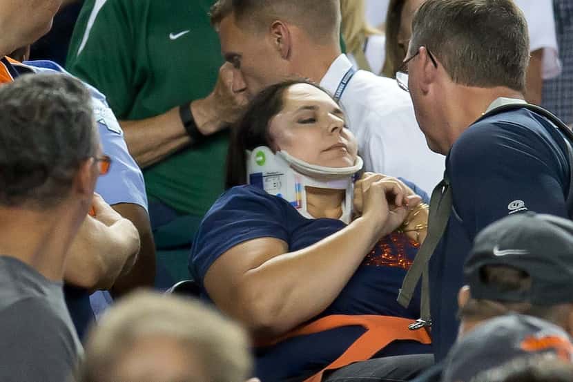 DETROIT, MI - AUGUST 21: A fan is carried out by medics after getting hit in the side of her...