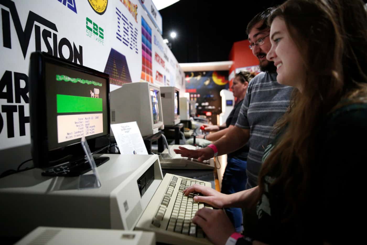 Lauren Howard and Taylor Carter play Oregon Trail at the National Videogame Museum in Frisco...