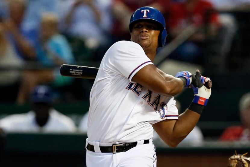Texas Rangers' Adrian Beltre swings at a pitch from the San Diego Padres in the fifth inning...