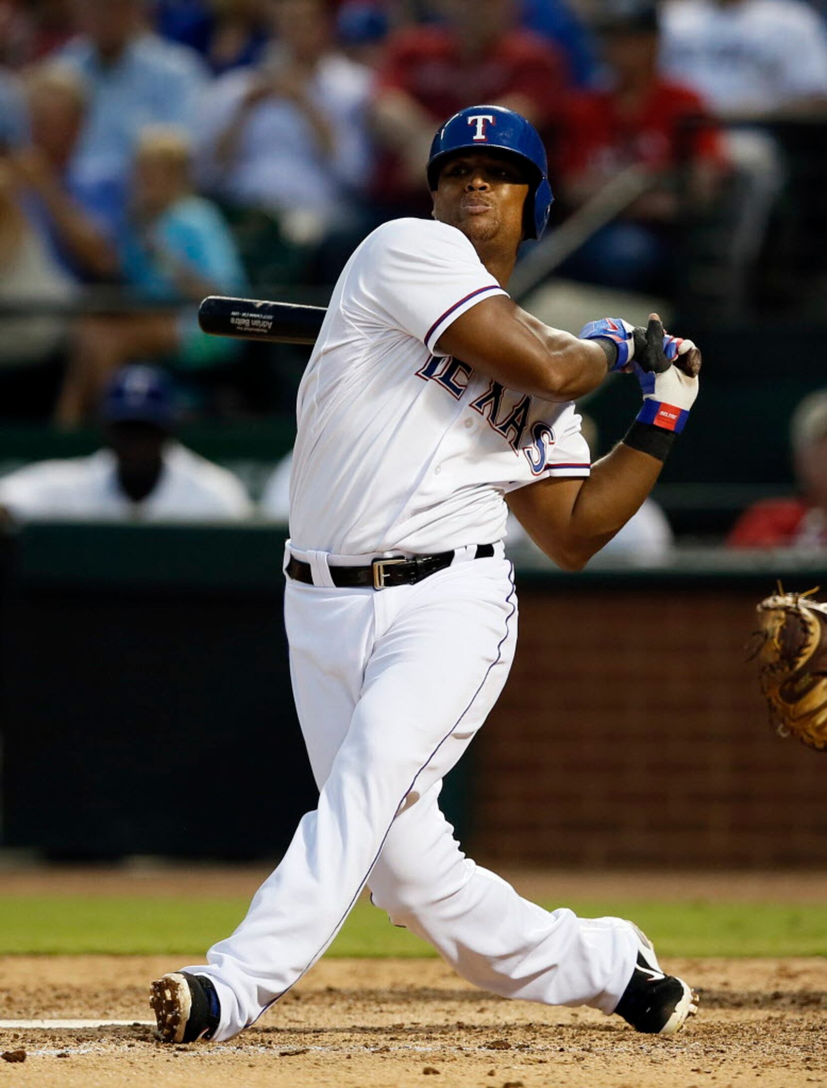 The Texas Rangers' Adrian Beltre and his son, Adrian Jr., 8, walk