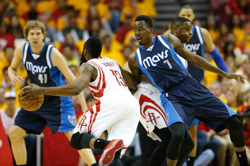 Houston Rockets guard James Harden (13) uses a screen from Houston Rockets forward Terrence...