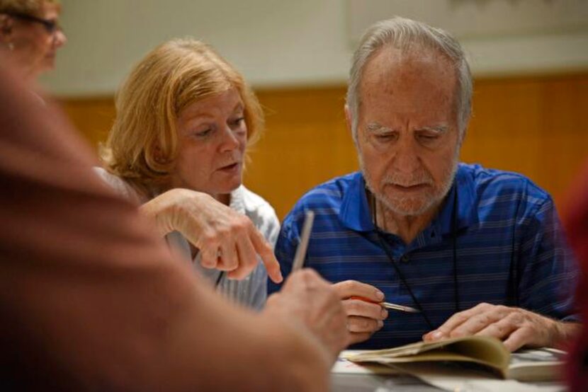 
Volunteer Debbie Snider helps G.G. Hampton paint a picture during the Casa de Vida program...