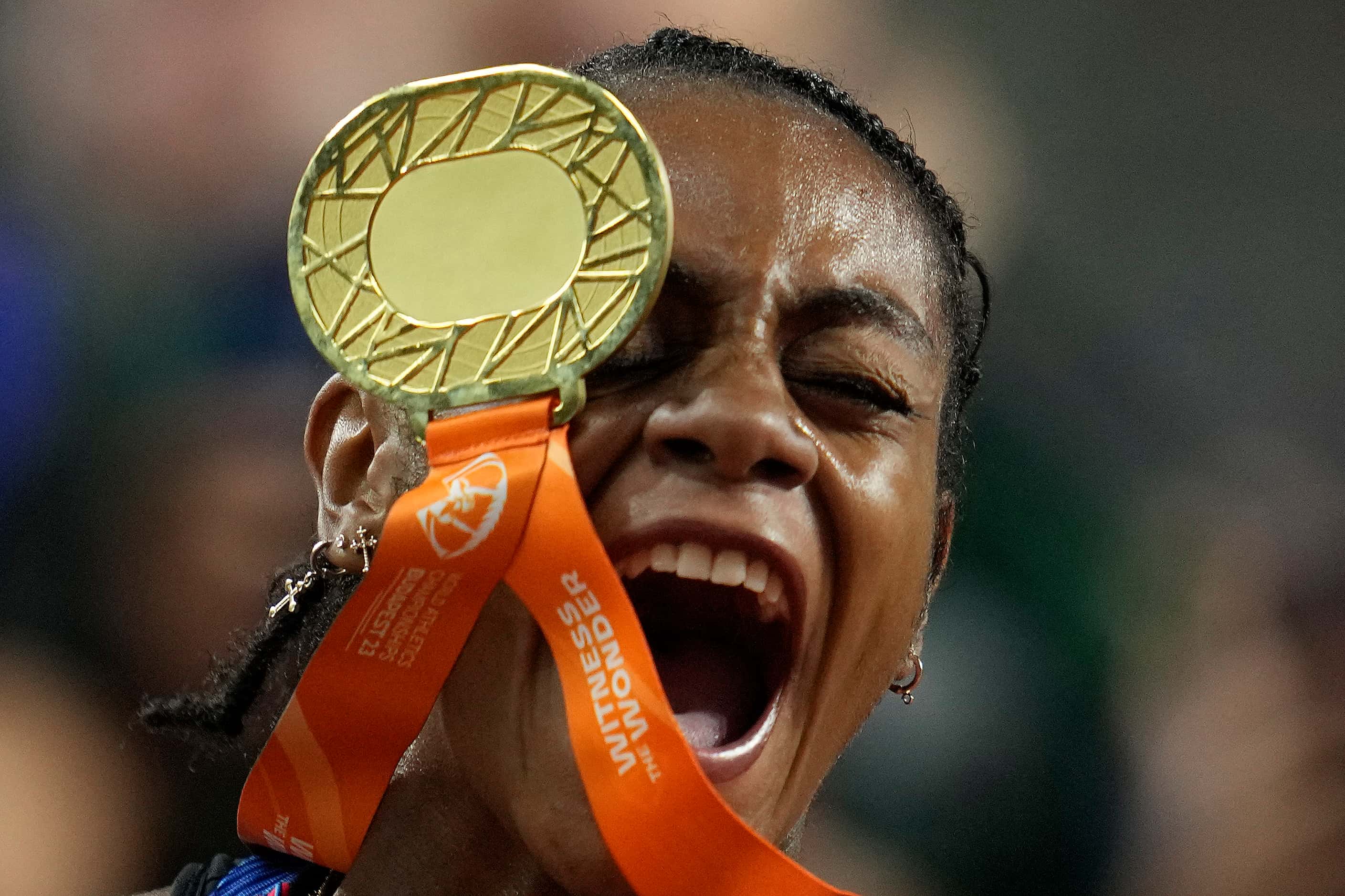 Sha'Carri Richardson, of the United States, celebrates after winning the gold medal for the...