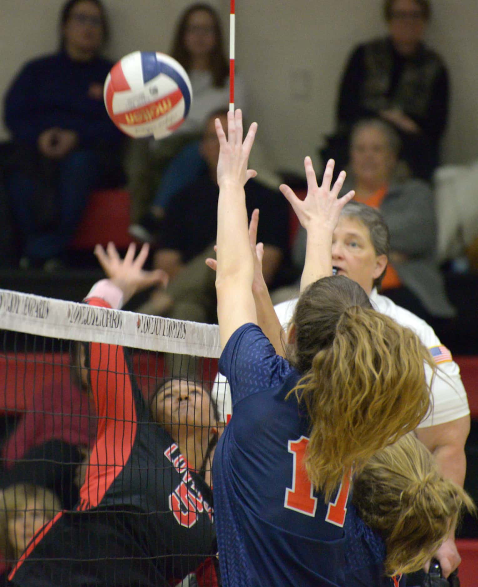 Lovejoy's Cecily Bramschreiber (5) goes up for a spike on McKinney North's Natalie...