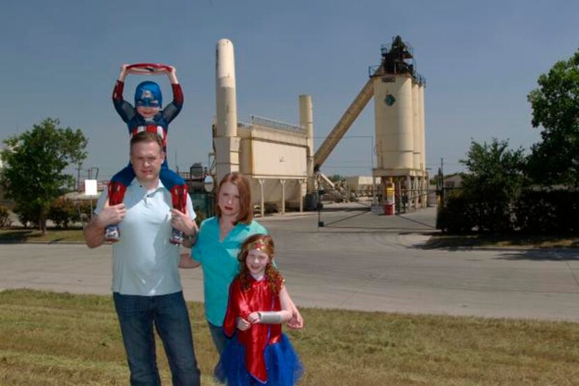 
Robin Harper — with husband John and children Hayden, 4, and Hadley, 6, who wear superhero...