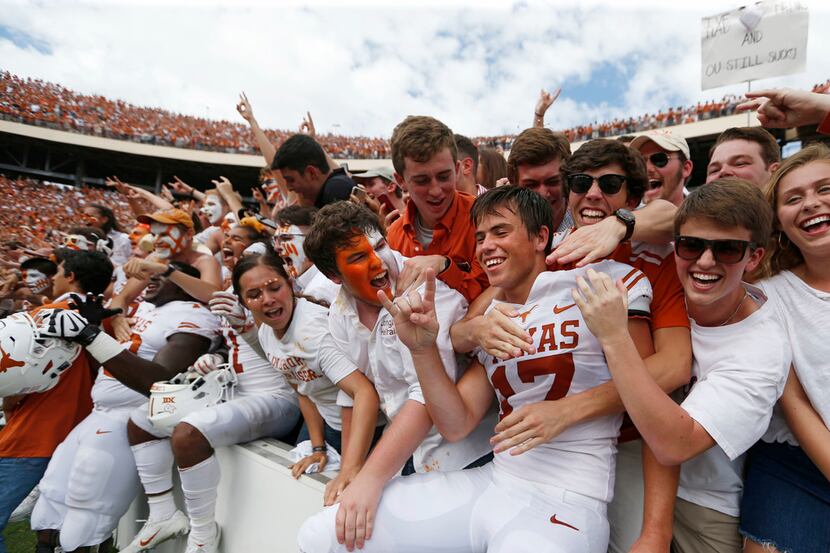 Texas Longhorns place kicker Cameron Dicker (17) celebrates with fans after defeating the...