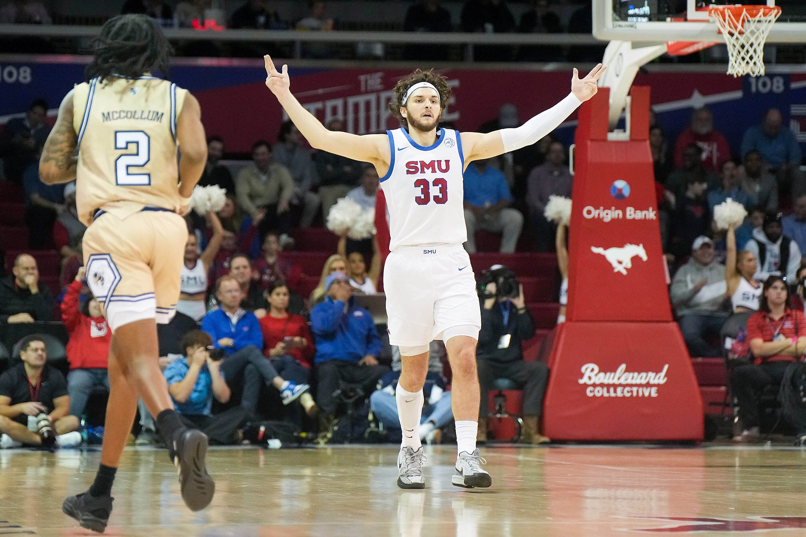 SMU forward Matt Cross (33) celebrates a basket during the first half of an NCAA men’s...