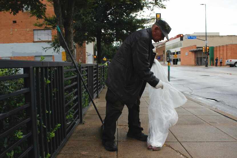 Roger Hamilton, 53, serves his two hours of community service to clear his record of...