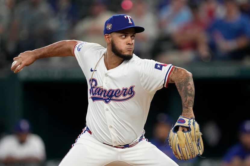 Texas Rangers relief pitcher Jonathan Hernandez throws to the Washington Nationals during...