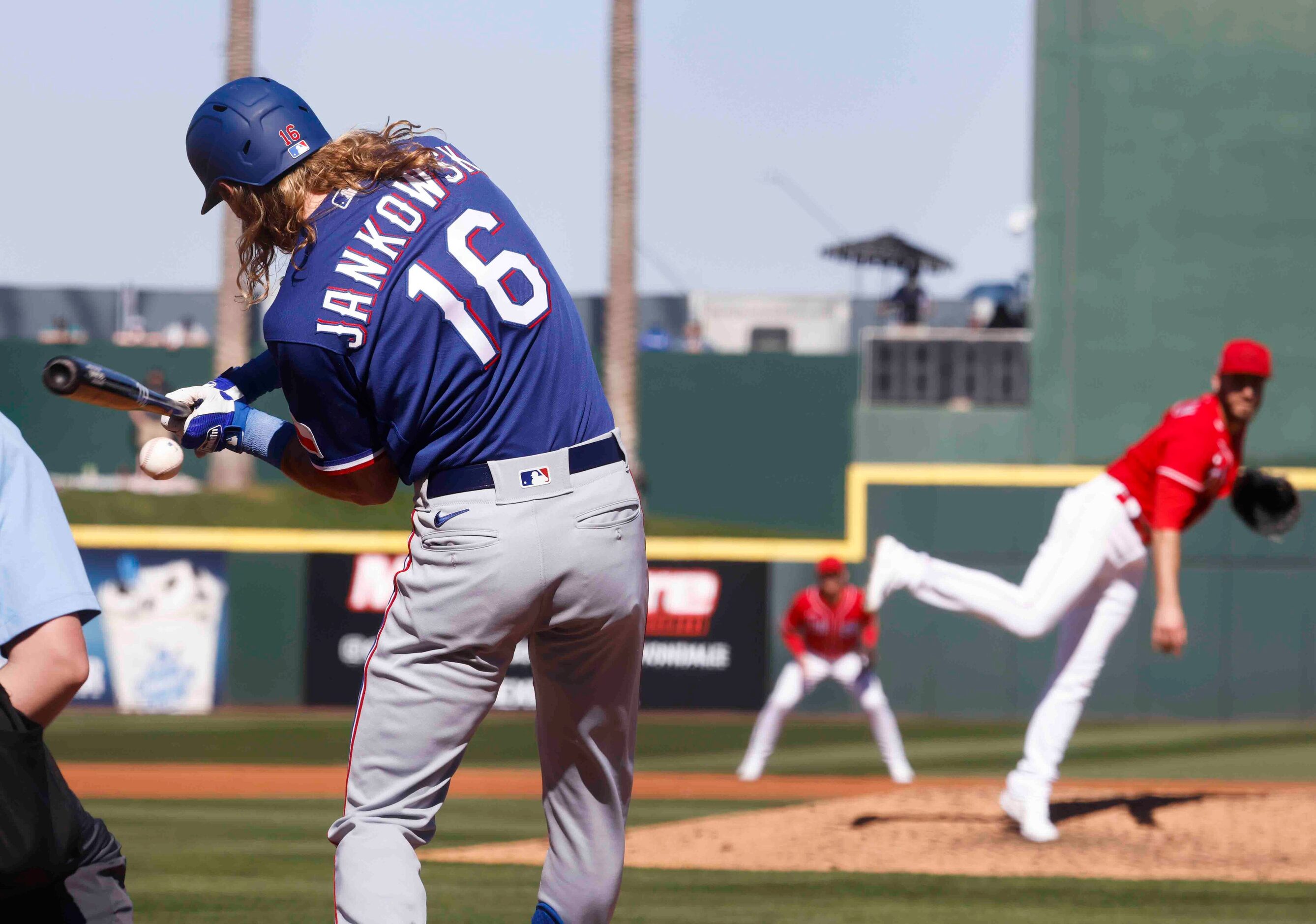 Texas Rangers Travis Jankowski hits a line drive during the third inning of a spring...