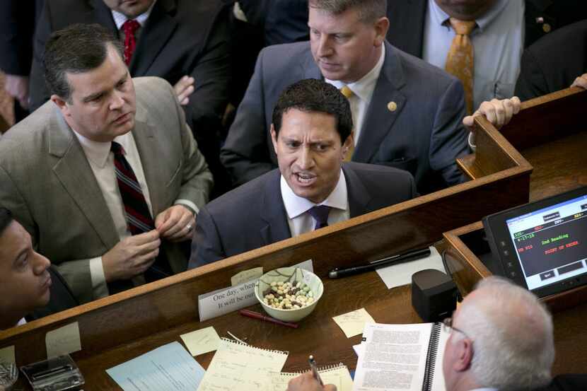 Rep. Trey Martinez Fischer (middle),  shown in a 2015 session debate, said Monday that...