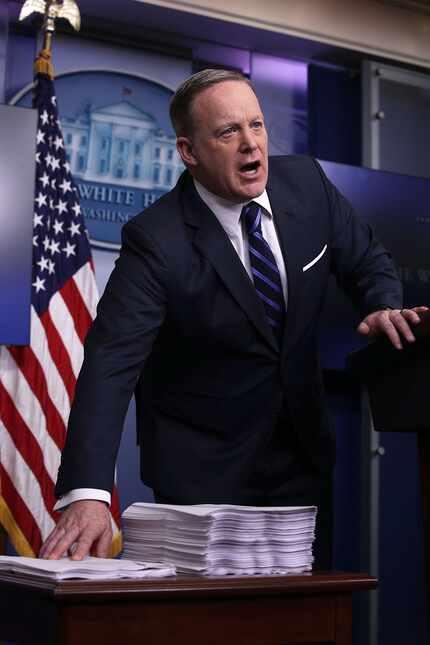 White House press secretary Sean Spicer compared a copy of the Obamacare bill (right) with a...