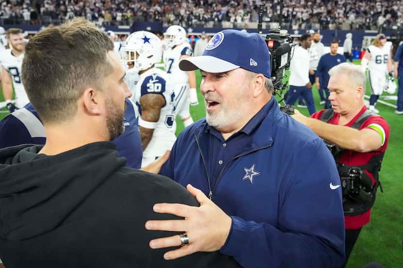 Dallas Cowboys head coach Mike McCarthy talks with Philadelphia Eagles head coach Nick...